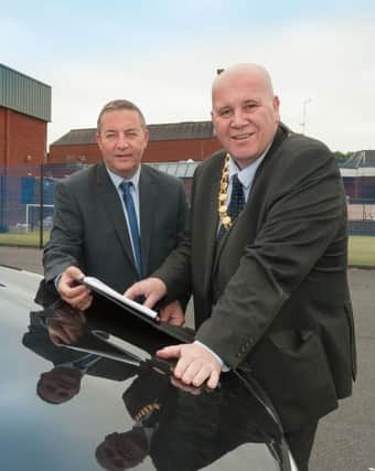 Councillor Paul Reid with councils car parking manager Andrew Oliver.