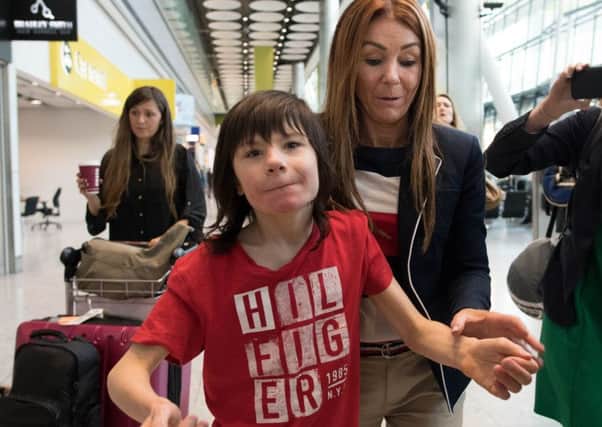 Charlotte Caldwell and her son Billy at Heathrow Airport after having a supply of cannabis oil used to treat his severe epilepsy confiscated on their return from Canada. PRESS ASSOCIATION Photo. Picture date: Monday June 11, 2018.