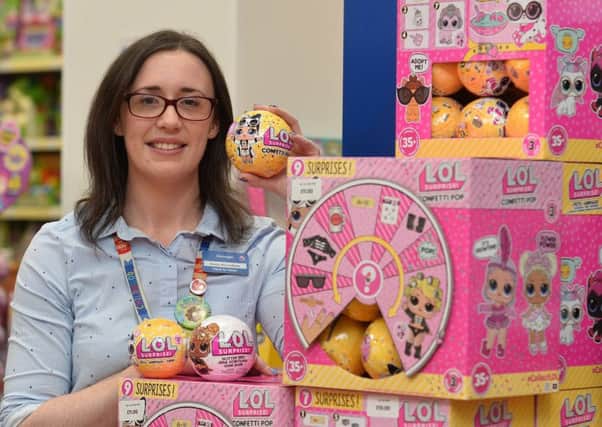 Kirsty McCandless with the popular LOL Dolls at The Entertainer toy shop in CastleCourt. 
Pic Pacemaker
