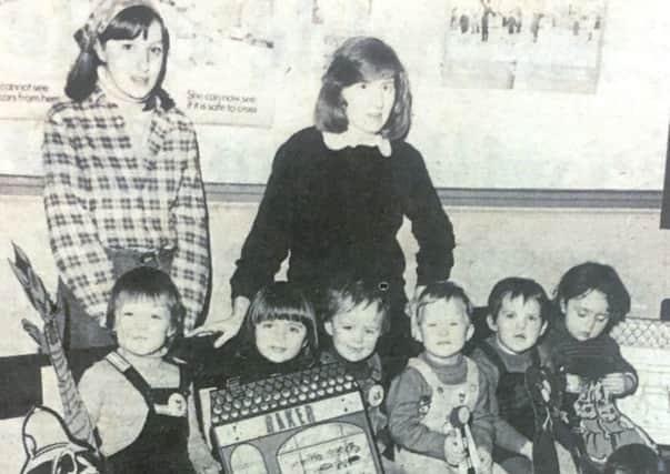 Leaders Helen Robinson and Deirdre McSherry pictured in 1981 with childrfen of the Tufty Club in Carnegie Street LIbrary.