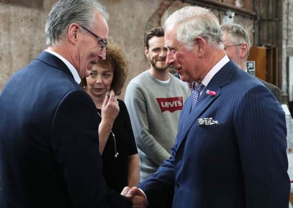 The Prince of Wales shakes hands with Sinn Fein MLA Gerry Kelly as her colleague Caral Ni Chuilin (second left) looks on at Carlisle Memorial Church in Belfast