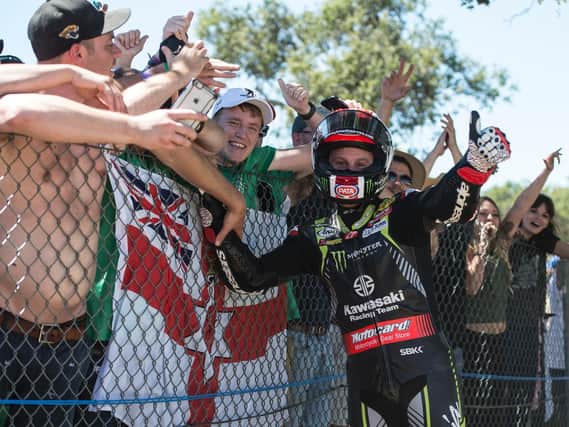 Jonathan Rea celebrates with fans at Laguna Seca in the USA.