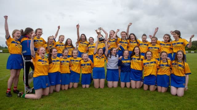 The Loreto College Camogie team celebrate its Fr Davies Cup victory