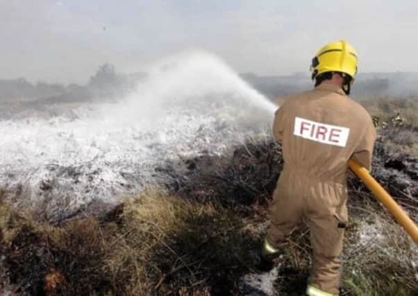 A firefighter tackling a gorse fire (file pic)