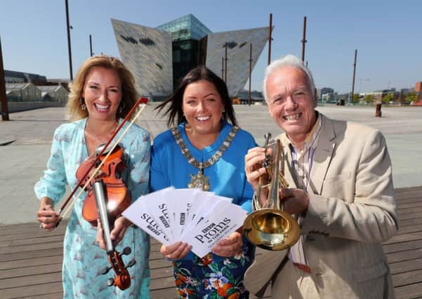 BBC Proms in the Park presenters Claire McCollum and Noel Thompson join forces with Lord Mayor of Belfast, Councillor Deirdre Hargey to announce this years event, which takes place at the Titanic Slipways in Belfast on Saturday, September 8.