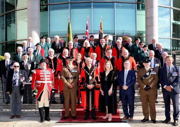 The Right Worshipful the Mayor of Lisburn & Castlereagh City Council, Cllr Uel Mackin; Chief Executive, Dr Theresa Donaldson; Lt Col Karl Frankland, Commanding Officer of NI Garrison Support Unit;  the Rt Hon Sir Jeffrey Donaldson MP; Captain Adam Chaytor, 2Rifles; Mr Raymond Corbett, President, Royal British Legion; Representatives from Armed Forces Organisations and Elected Members at the raising of the Armed Forces Flag.