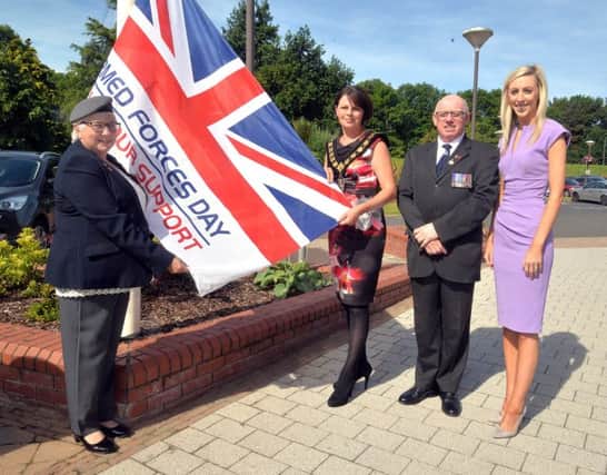 Lord Mayor, Councillor Julie Flaherty pictured with members of Donacloney Royal British Legion and Carla Lockhart MLA raising the Armed Forces Day Flag at Craigavon Civic and Conference Centre.