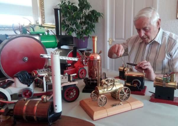 Brian Mehaffey with some of his steam-powered items