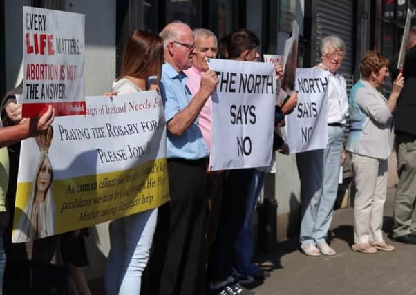 Anti-abortion protesters gathered outside Michelle O'Neill's constituency office in Coalisland on Wednesday morning.