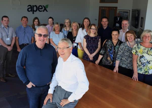 Pictured with Richard Moore is Gerry Kelly, Apex Chief Executive, and Apex staff.