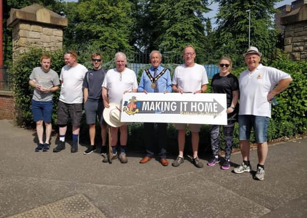 Cllr Uel Mackin Mayor of Lisburn and Castlereagh City Council met the walkers at the boundary of the Belfast City Council area at Seymour Hill.