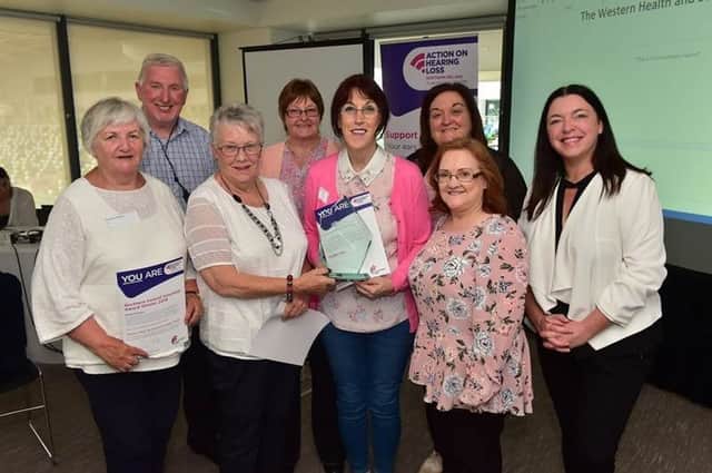 Western Trust Volunteers with Jackie White, Director at Action on Hearing Loss Northern Ireland (far right), Geraldine Keys, Information Officer (2nd right top) and Mary Cruickshank, Hearing Aid Liaison Officer (2nd right bottom)