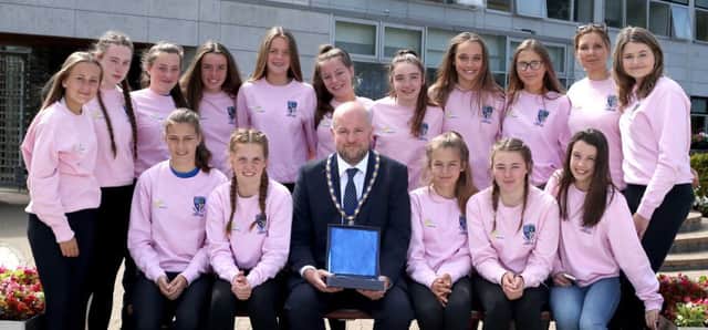 Members of Ballymoney Hockey Club Under 15 team, winners of the Ulster Plate, pictured with the Deputy Mayor of Causeway Coast and Glens Borough Council Councillor Trevor Clarke.