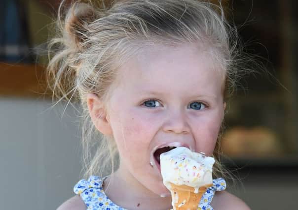 Young Grace Wall enjoys an ice cream at  Cafe Mauds on Belfast's Lisburn Road. Pic: Colm Lenaghan/Pacemaker