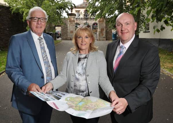 Promoting the Hillsborough Tour Guide course is Ald. Allan Ewart, Vice-Chairman of the Council's Development Committee; Colette McCafferty from Travel and Tourism Associates and Ald. William Leathem, Chairman of the Council's Development Committee.