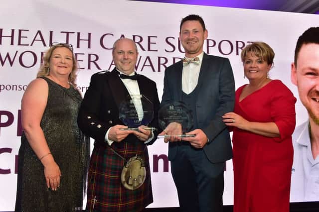 Pictured (L-R) are: Colette Baker, LV, Craig Chambers and Philip Martin, winners of the Health Care Support Worker Award and Janice Smyth, Director of the RCN in Northern Ireland.