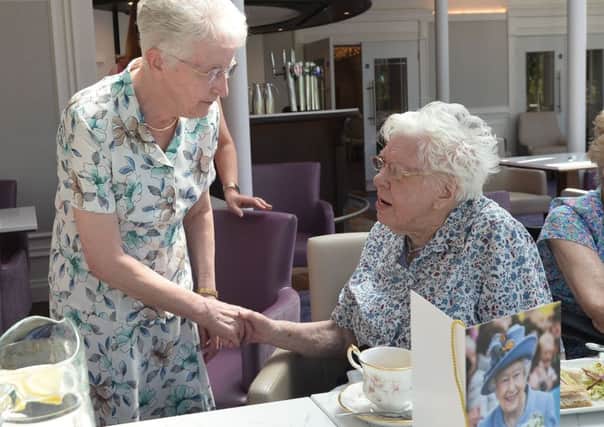 Dorothy McKee, left, on her 80th birthday meets Maud Nicholl on her 109th as both celebrate the date at the Tullyglass hotel. Pic Colm Lenaghan/Pacemaker