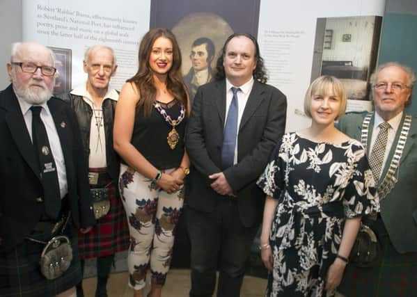 The Mayor of Mid and East Antrim, Cllr Lindsay Millar at the 'Hand To The Plough' exhibition with Tom Beckett, vice-
president Belfast Burns Association;  William McPherson, past president of BBA; Dr Frank Ferguson, Ulster University; Samantha McCombe, Linen Hall librarian and  Denis Currie, president of BBA.