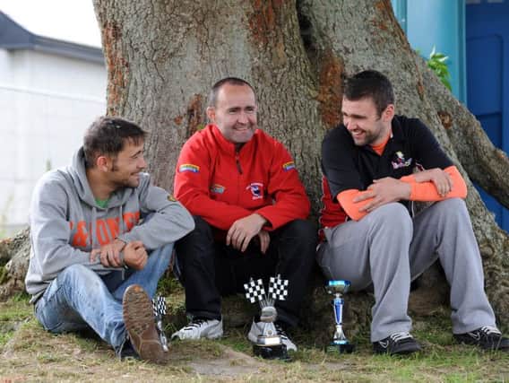 William Dunlop (right) with his cousins Sam Dunlop and Paul Robinson (centre) at the Walderstown road races in County Westmeath in 2012.
