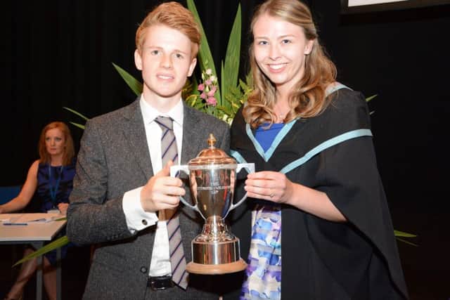 Ballymena student, Beatrice Kane, picked up a top award for outstanding academic achievement from Stranmillis University College at the Colleges annual awards ceremony.  Beatrice is pictured with guest speaker, Daniel Clawson.