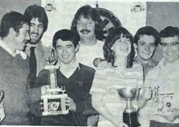 Walsh's darts and pool club held a presentation night in 1981 when they handed over a cheque for Â£120 to the Gamma Camera Fund. Pictured are Dessie Walsh,  Tom Patrterson, Dr Scally, Martin Leathem and Joe Harte with members of the club.
