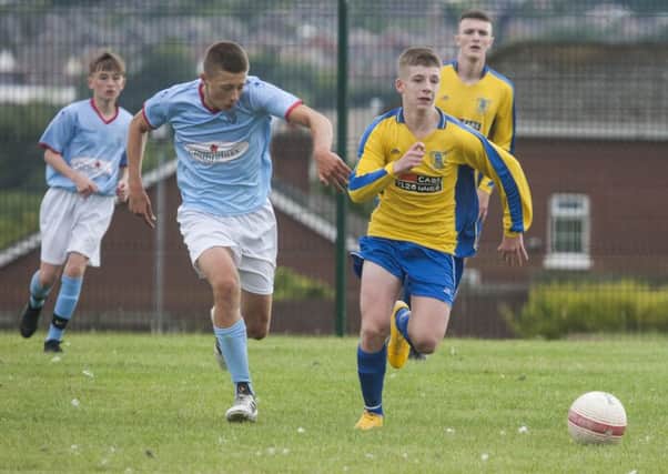 Trojans Nathan McCrudden races away with the ball in the Foyle Cup game against Ballymena United.