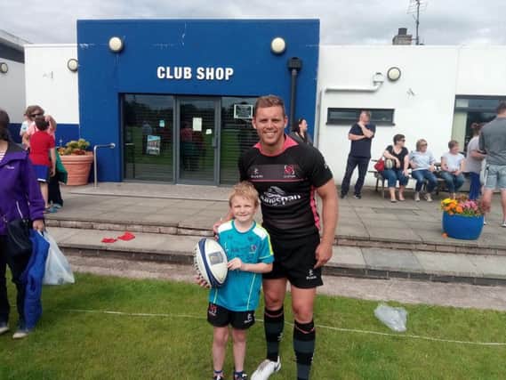 Ulster's Darren Cave with a young fan at Coleraine