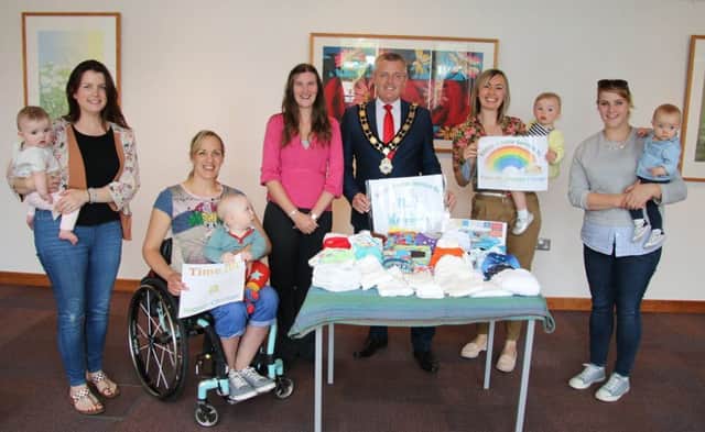 Mayor of Antrim and Newtownabbey, Councillor Paul Michael and Nicola Watson from the Nappy Advice Service NI promoting the cloth nappy packs. They are joined by local families who are currently trialling the cloth nappies; Samantha Logan & daughter Edith, Jean Daley-Lynn & son Harrison, Paula Hopwood & daughter Alana and Aimee Ellis & daughter Leila.