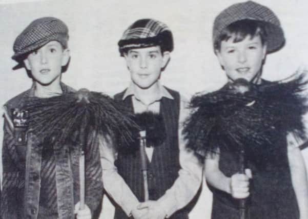 Mark Montgomery, Richard Gibson and Gareth Fullerton dressed for their part in Third Ballymena Boys' Brigade annual display. 1989.