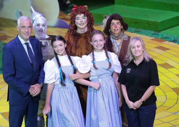 From L to R: Jonathan Martindale, Executive Director, Phoenix Natural Gas, Conall McGinn as Tin Man, Holly Topping as Dorothy, Alex Jemphrey as Cowardly Lion, Caroline McMichael as Dorothy, Peter Gildernew as Scarecrow and Ãine Dolan, Creative Learning Manager and Associate Producer of the Grand Opera House Youth Production.