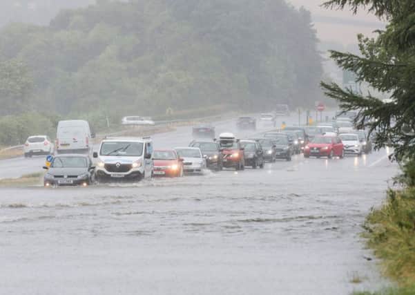 Motorists on the A1 dual carriageway at Dromore, Co Down, being confronted with a lake across the lanes on Saturday
