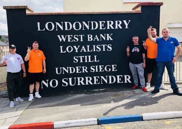 Paul Golding (second from left) with other representatives/ supporters of Britain First in Londonderry at the weekend.