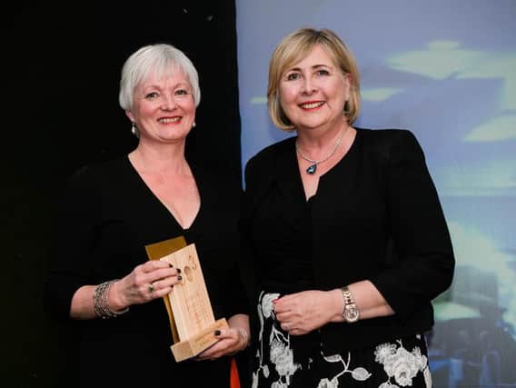 Heather is pictured receiving a CO3 award for Leading Forward on Health and Social Care Reform from Jackie McIlroy (Office of Social Services at DOH)