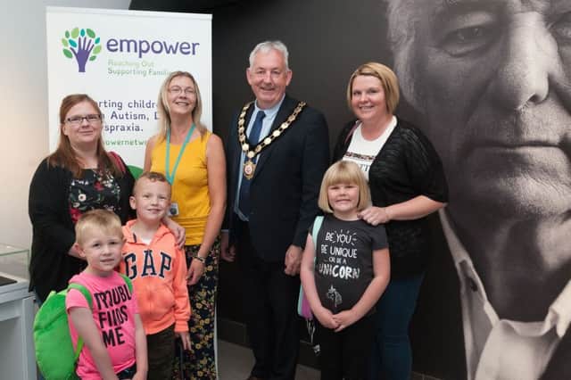 Councillor Sean Mc Peake and Marie Mc Cloy, Empower Project Manager with parents and children who attended the Empower Project Movie Day at Seamus Heaney HomePlace. Included in the photo are Rhonda Davison and her children Isla and Alexander and Kirsty Anne Takel and her son Thomas.
