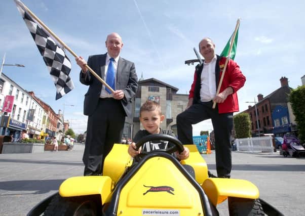 Launching the Honey Badgers Go Karts event in Lisburn Square, Saturday 4th August from 1pm-3pm are Alderman William Leathem, Chair of the Council's Development Committee; Silipos Sitos and Roy Faulkner, Honey Badgers Go Karts.