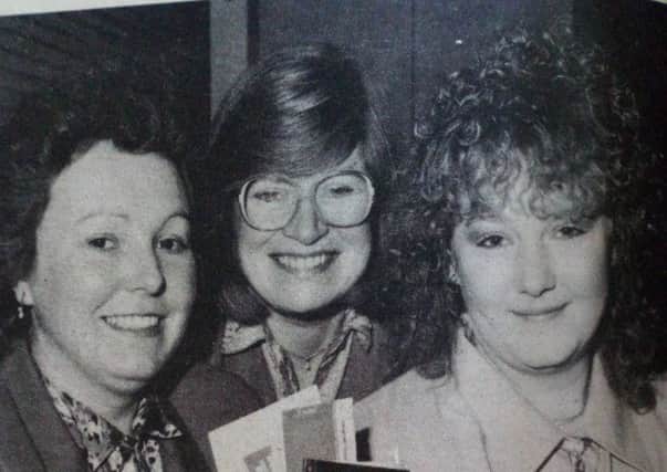 Jane Tweed (right) pictured as she sets off for Florida. Presenting her with her plane tickets (from left) are Rosemary Scallon (training adviser - Catering Industry Training Board) and Ann Williams (Chief Executive - Catering Industry Training Board). 1989