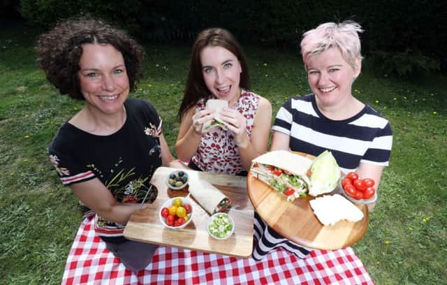 L-R Centra Health and Nutrition Ambassador Jane McClenaghan, Translink's Ursula Henderson and SuperValu Vegetarian Ambassador Sarah Patterson announce Ballynure woman Lorraine Surgin as a finalist of the Healthy Lunch Off competition.It's now up to the public to decide which should win.  Entries close on Wednesday 8th August. Pictures by William Cherry, Press Eye.