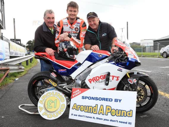 Conor Cummins with the Padgett's Honda RC213V-S pictured with Robert Graham, Chairman of the Dundrod & District Motorcycle Club, and Superbike race sponsor Gerard Rice of Around a Pound.