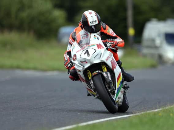 Manx rider Conor Cummins claimed pole in the Superbike class at the MCE Ulster Grand Prix.