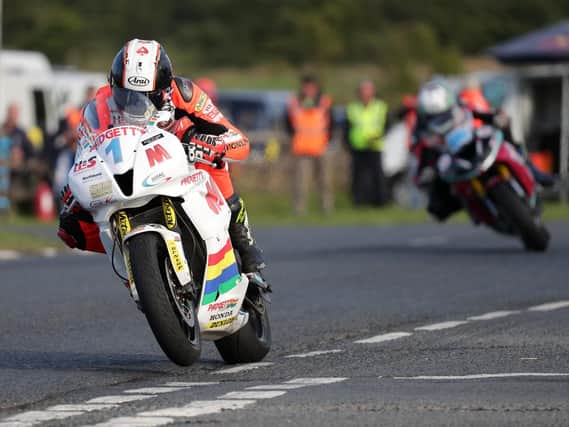 Conor Cummins (Padgett's Honda) leads Adam McLean (McAdoo Kawasaki) on his way to victory in the Supersport race.