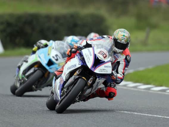 Peter Hickman (Smiths BMW) leads Dean Harrison (Silicone Engineering Kawasaki) in the Superbike race.