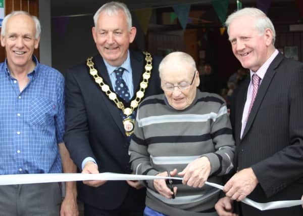 Gerard Walls chair of the Knocknagin Hall Committee; Clr Sean Mc Peake Chair of Mid-Ulster District Council;  Harry Loane; Clr Sean Clarke, Chair of Mid-Ulster Rural Development Partnership; Austin Kelly LAG member, as Harry Loane  cut the ribbon to officially open Desertmartin Community and Learning Hub.