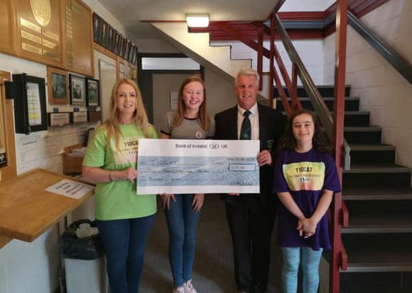 Louise Fay, Cliodhna Madden, Michael McDonald and Eva Tennyson. Michael is captain of Silverwood Golf Club presented Louise with a cheque for Â£601.