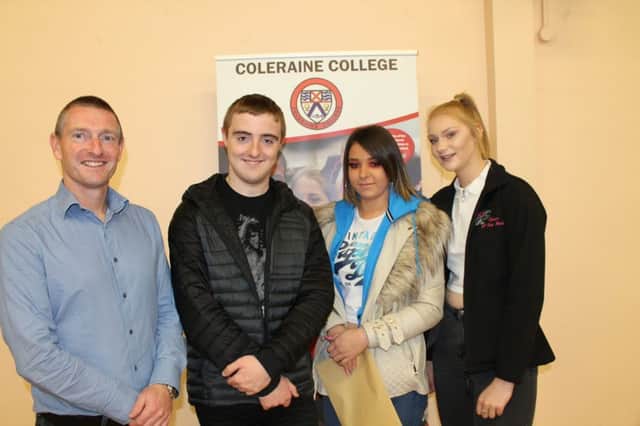 Principal Ricky Marsh with Year 12 students Stuart, Paige and Rebekah who were collecting their GCSE exam results.