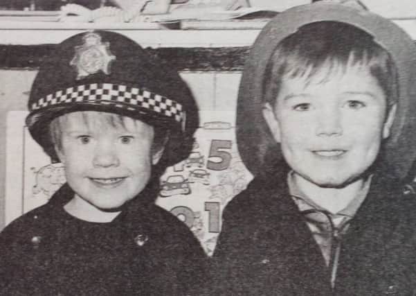 Police Chief Declan Quinn and the fire officer Jonathan Reid at the St. Nicholas Pre-School Play Group, Carrickfergus. 1991.