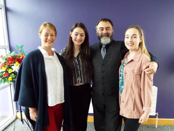 Mallory Lutton (second left),one of the top performers at Rathfriland High School in this year's GCSEs, pictured with her parents and her older sister.
