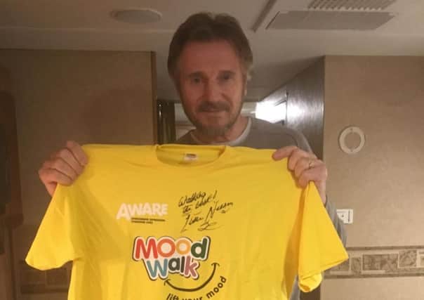 Actor Liam Neeson is supporting AWARE and their three upcoming N.I. Mood Walks to mark World Suicide Prevention Day. He found time during filming recently in Northern Ireland to sign a Mood Walk t-shirt. Those who register for a walk online using the AWARE website  will be entered into a draw to win the t-shirt. For more information visit www.aware-ni.org