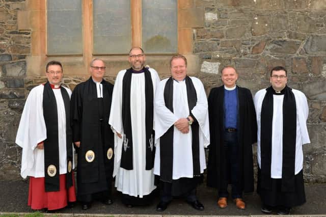 There was a large turnout in St Cedmas Parish Church for the institution of Rev David Lockhart (4th left) as the new Rector of the parishes of Larne & Inver with Glynn and Raloo, also pictured are (L to R) Venerable Paul Dundass, Archdeacon of Dalriada, Canon William Taggart, Registrar, Venerable George Davison, Archdeacon of Belfast, Rev William Henry, Preacher from the Maze Presbyterian Church and former Curate of the Parishes, Rev Philip Benson. INLT 36-001-PSB