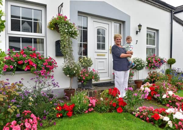 The Mid & East Antrim In Bloom Community Competition Best Kept Front Garden Winner: Janet Ashington, Gracehill, pictured with grandson Teddy.