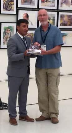 Tommy pictured receiving his award from IWS Global President Mr Atanur
Dogan.